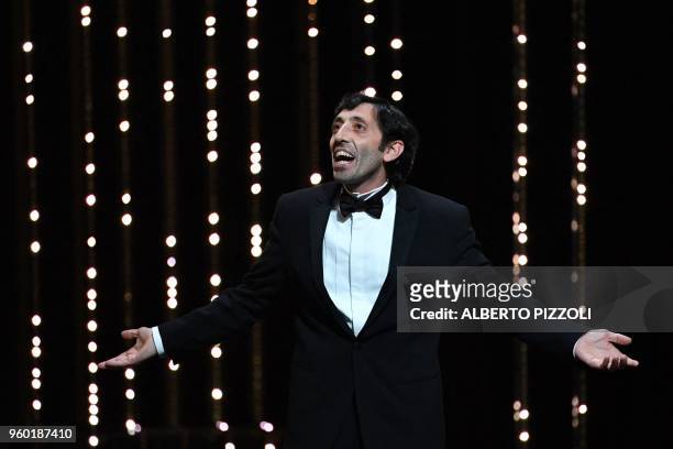 Italian actor Marcello Fonte celebrates after he was awarded with the Best Actor Prize for his part in the film "Dogman" on May 19, 2018 during the...