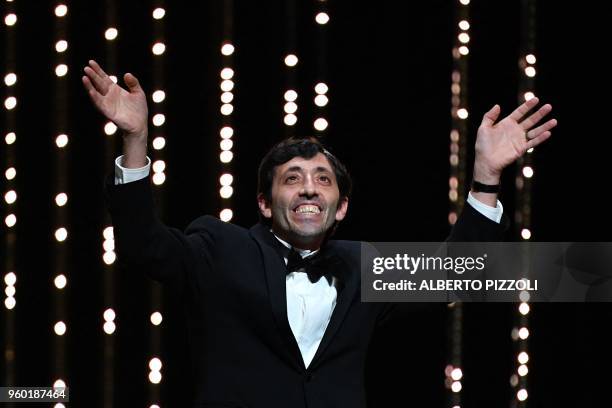 Italian actor Marcello Fonte celebrates after he was awarded with the Best Actor Prize for his part in the film "Dogman" on May 19, 2018 during the...