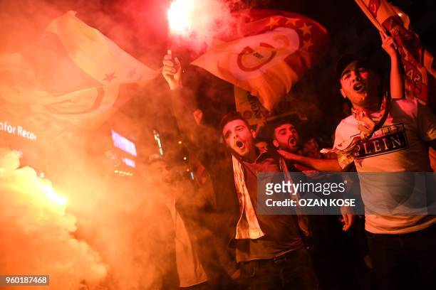 Galatasaray's supporters celebrate their 2017-2018 champion title in Istanbul on May 19 after the Turkish Spor Toto Super league football match...