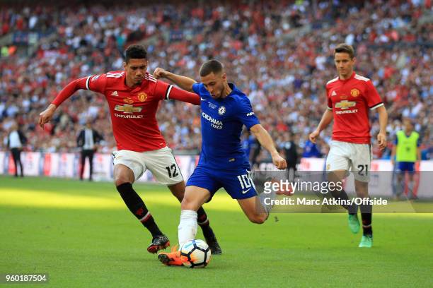 Eden Hazard of Chelsea in action with Chris Smalling Ander Herrera of Manchester United during The Emirates FA Cup Final between Chelsea and...