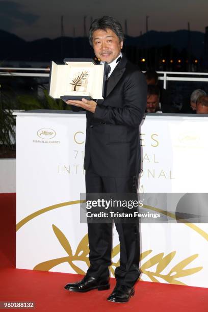 Director Hirokazu Koreeda poses with the Palme d'Or award for 'Shoplifters' at the photocall the Palme D'Or Winner during the 71st annual Cannes Film...