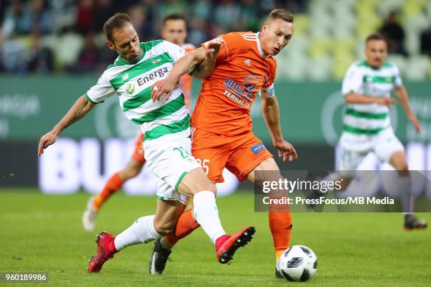Flavio Paixao of Lechia Gdansk competes with Mateusz Kupczak of Bruk Bet Termalica Nieciecza during Lotto Ekstraklasa match between Lechia Gdansk and...