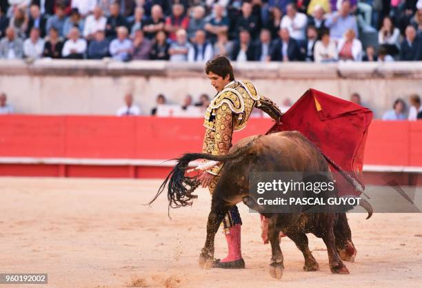 French matador Sebastien Castella makes a muleta pass on a Garcigrande fighting bull on May 19, 2018 during the Nîmes Pentecost Feria, southern...