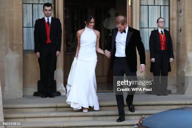 Duchess of Sussex and Prince Harry, Duke of Sussex leave Windsor Castle after their wedding to attend an evening reception at Frogmore House, hosted...
