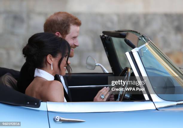 Duchess of Sussex and Prince Harry, Duke of Sussex leave Windsor Castle after their wedding to attend an evening reception at Frogmore House, hosted...