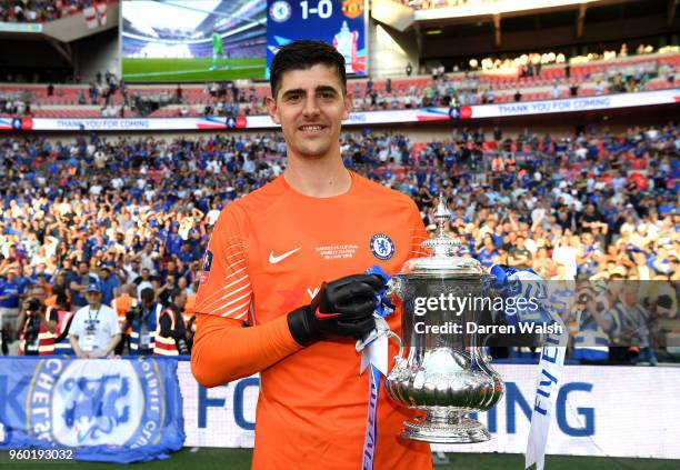 Thibaut Courtois of Chelsea poses with the Emirates FA Cup trophy following his side's victory during The Emirates FA Cup Final between Chelsea and...