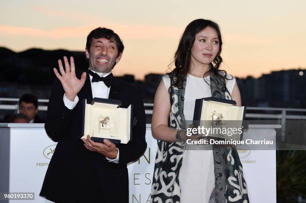 Actress Samal Yeslyamova poses with the Best Actress award for her role in 'Ayka' and actor Marcello Fonte poses with the Best Actor award for his...