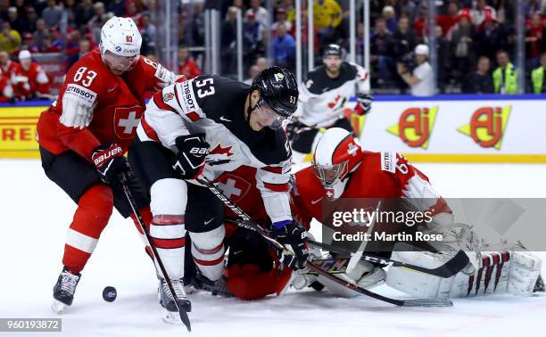 Bo Horvat of Canada fails to score over Leonardo Genoni, goaltender of Switzerland during the 2018 IIHF Ice Hockey World Championship Semi Final game...