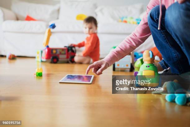 kids using a digital tablet - thanasis zovoilis stock pictures, royalty-free photos & images