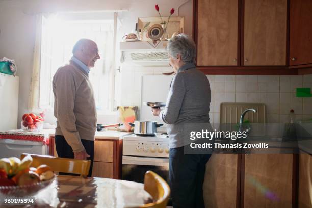 portrait of a senior couple indoor - thanasis zovoilis stock pictures, royalty-free photos & images