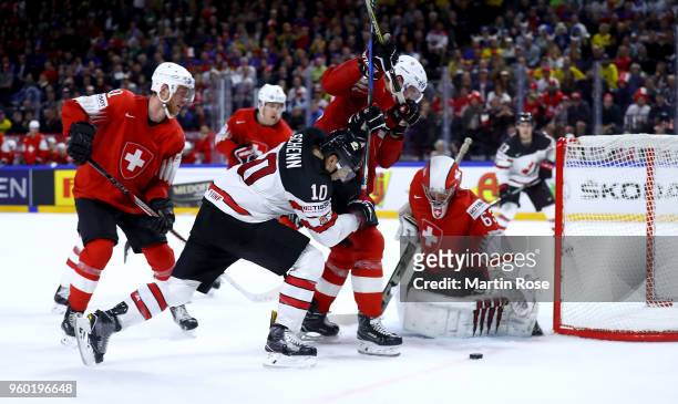 Bryaden Schenn of Canada fails to score over Leonardo Genoni, goaltender of Switzerland during the 2018 IIHF Ice Hockey World Championship Semi Final...