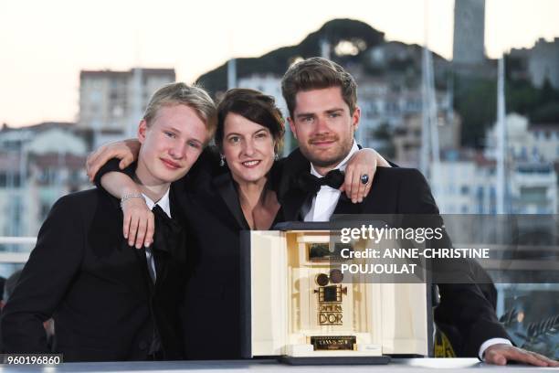 Swiss director and President of the Camera d'Or jury Ursula Meier poses with Belgian director Lukas Dhont and Belgian actor Victor Polster on May 19,...