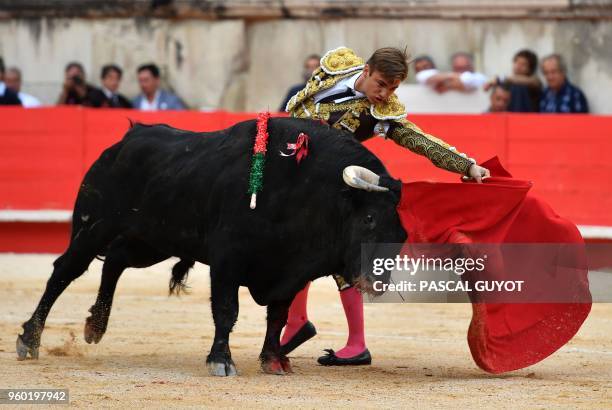 French matador Andy Younes makes a muleta pass on a Garcigrande fighting bull on May 19, 2018 during the Nîmes Pentecost Feria, southern France.