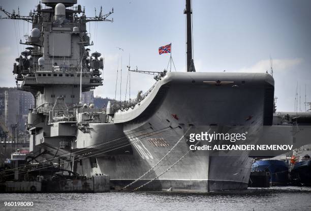 Russian aircraft carrier Admiral Kuznetsov tied up at a Rosatomflot moorage of the Russian northern port city of Murmansk on May 19, 2018. - Admiral...