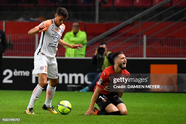 Montpellier's French forward Jeremie Porsan-Clemente vies with Rennes' Algerian defender Ramy Bensebaini during the French L1 football match Rennes...