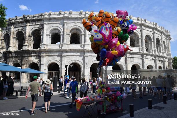 People arrive to attend the Pentecost Feria of Nimes, southern France, on May 19, 2018.