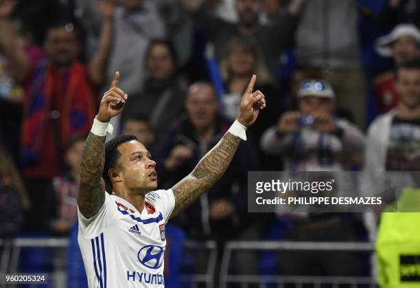 Lyon's Dutch forward Memphis Depay reacts after scoring during the French L1 football match between Olympique Lyonnais and OGC Nice, on May 19 at the...