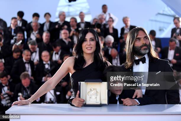 Director Nadine Labaki, actor Zain Alrafeea and Composer Khaled Mouzanar pose with the Jury Prize award for 'Capharnaum 'at the Palme D'Or Winner...