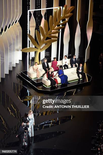 Lebanese director and actress Nadine Labaki poses on stage with Syrian actor Zain al-Rafeea , her husband Lebanese producer Khaled Mouzanar , British...