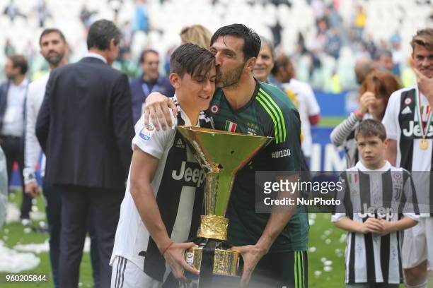 Gianluigi Buffon and Paulo Dybala celebrates with the Scudetto cup after the winning of the Italian championship 2017-2018 at the Allianz stadium on...