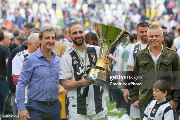 Gonzalo Higuain and his family celebrates with the Scudetto cup after the winning of the Italian championship 2017-2018 at the Allianz stadium on May...