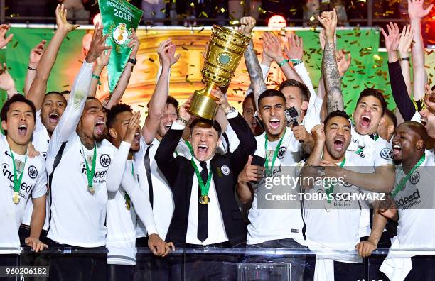 Frankfurt's Croatian head coach Niko Kovac and Frankfurt's players celebrate with the trophy after the German Cup DFB Pokal final football match FC...