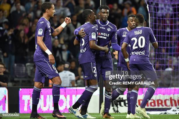 Toulouse's forward Yaya Sanogo celebrates with teammates after scoring his team's second goal during the French L1 match between Toulouse and...