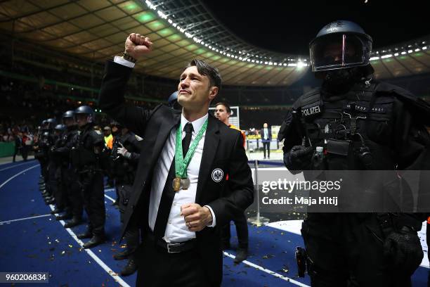 Coach Niko Kovac of Frankfurt applauds the supporters under police protection during the DFB Cup final between Bayern Muenchen and Eintracht...