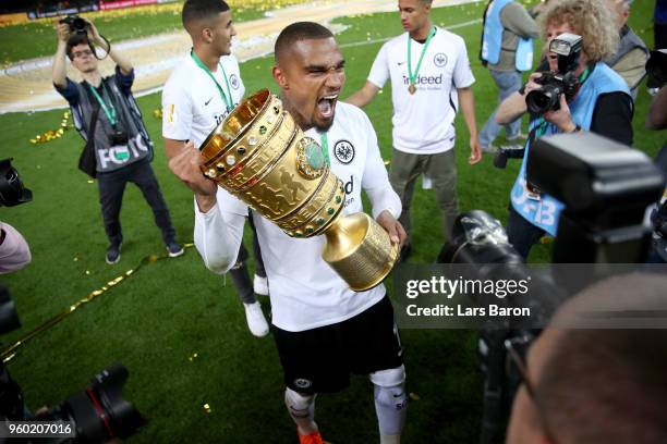 Kevin Prince Boateng celebrates with the DFB Cup trophy after winning the DFB Cup final against Bayern Muenchen at Olympiastadion on May 19, 2018 in...