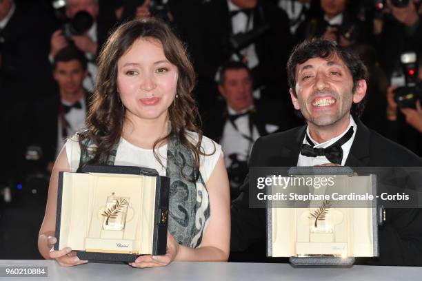 Actress Samal Yeslyamova poses with the Best Actress award for her role in 'Ayka' and actor Marcello Fonte poses with the Best Actor award for his...