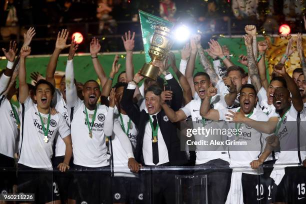 Head coach of Eintracht Frankfurt Niko Kovac lifts the DFB Cup trophy after winning the DFB Cup final against Bayern Muenchen at Olympiastadion on...