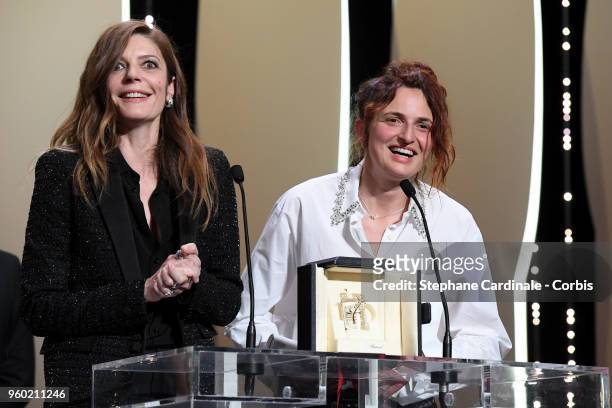 Chiara Mastroianni looks on as director Alice Rohrwacher receives the the Best Screenplay award for Happy As Lazzaro on stage during the Closing...