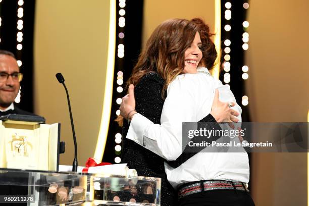 Chiara Mastroianni hugs director Alice Rohrwacher as she receives the the Best Screenplay award for Happy As Lazzaro on stage during the Closing...
