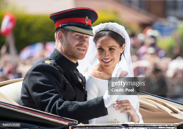 Prince Harry, Duke of Sussex and Meghan, Duchess of Sussex ride by carriage following their wedding at St George's Chapel, Windsor Castle on May 19,...