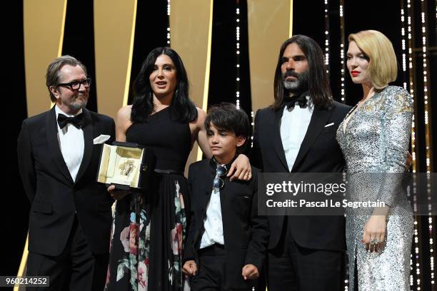 Director Nadine Labaki receives the Jury Prize award for 'Capharnaum' as Gary Oldman, actor Zain Alrafeea, producer Khaled Mouzanar and Jury member...