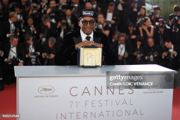 Director Spike Lee poses with his trophy on May 19, 2018 during a photocall after he won the Grand Prix for the film "BlacKkKlansman" at the 71st...