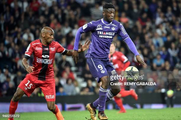 Toulouse's forwar Yay Sanogo run with the ball during the French L1 match between Toulouse and Guingamp on may 19 at the Municipal Stadium in...