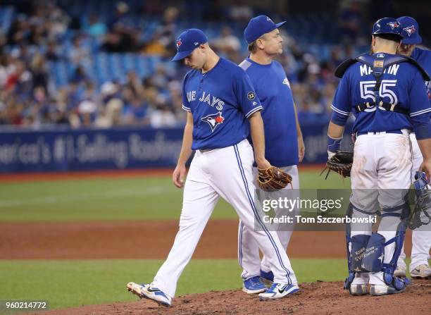 Sam Gaviglio of the Toronto Blue Jays exits the game as he is relieved by manager John Gibbons in the fifth inning during MLB game action against the...