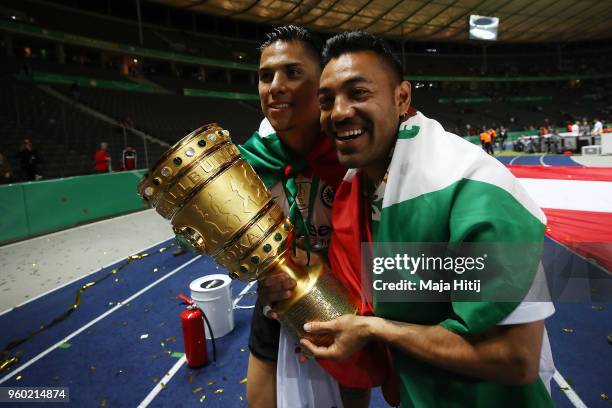 Carlos Salcedo of Frankfurt and Marco Fabian of Frankfurt pose with the trophy after the DFB Cup final between Bayern Muenchen and Eintracht...
