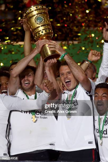 Alexander Meier of Eintracht Frankfurt lifts the DFB Cup trophy after winning the DFB Cup final against Bayern Muenchen at Olympiastadion on May 19,...