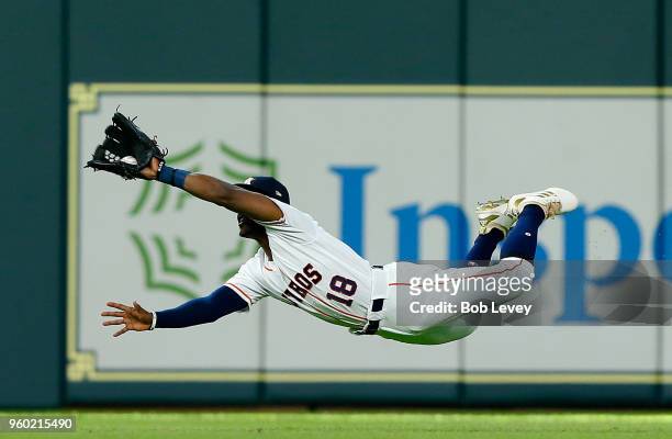 Tony Kemp of the Houston Astros makes a diving catch on a line drive by Brandon Guyer of the Cleveland Indians in the third inning at Minute Maid...