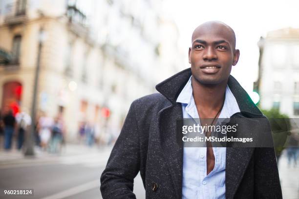 portrait of a smiling african man - nigeria man stock pictures, royalty-free photos & images