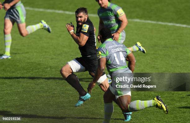 Don Armand of Exeter Chiefs breaks away from Vereniki Goneva to score their final try during the Aviva Premiership Semi Final between Exeter Chiefs...