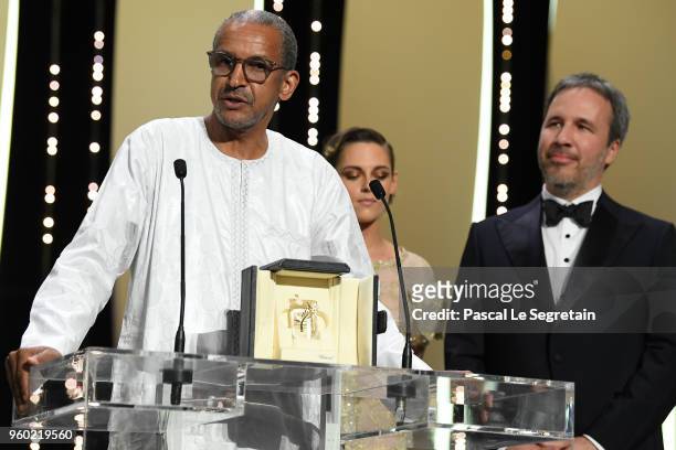 Director Abderrahmane Sissako, jury members Kristen Stewart and Denis Villeneuve are seen on stage during the closing ceremony of the 71st annual...