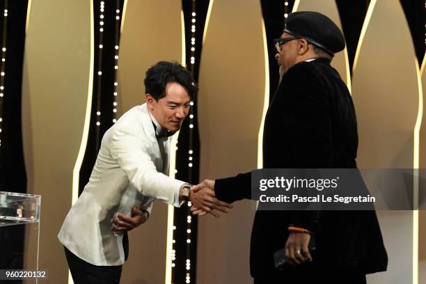 Jury members Chang Chen walks greets with Spike Lee as he receives the Grand Prix award for 'BlacKkKlansman during the Closing Ceremony at the 71st...