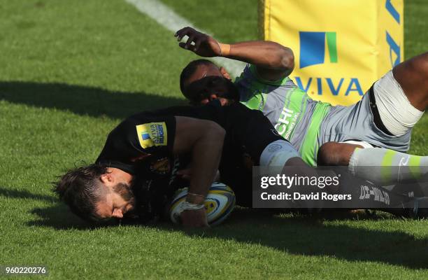 Don Armand of Exeter evades Vereniki Goneva to score their final try during the Aviva Premiership Semi Final between Exeter Chiefs and Newcastle...