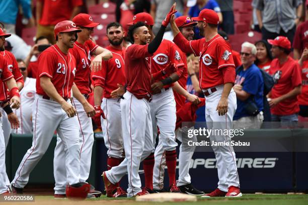 Billy Hamilton of the Cincinnati Reds celebrates with Matt Harvey of the Cincinnati Reds after walking in the winning run in the eleventh inning...