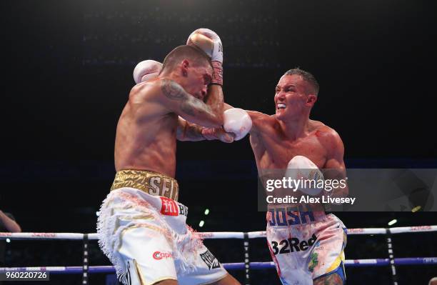 Josh Warrington lands a right shot on Lee Selby during IBF Featherweight Championship fight at Elland Road on May 19, 2018 in Leeds, England.