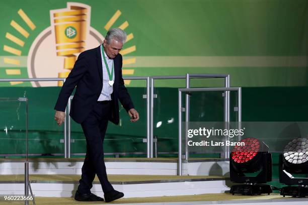 Josef Heynckes of Bayern Muenchen walks past the trophy after losing the DFB Cup final against Eintracht Frankfurt at Olympiastadion on May 19, 2018...