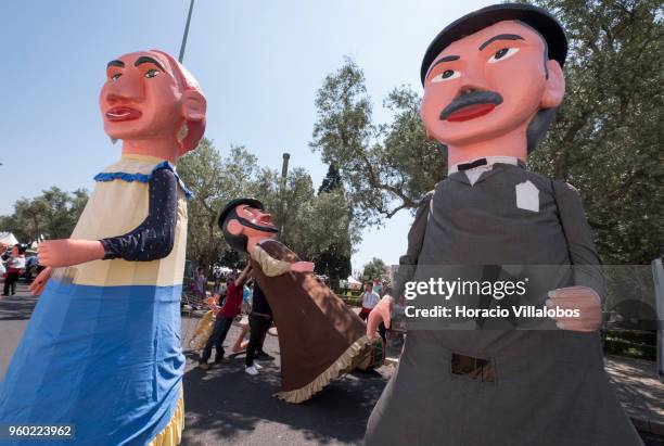 Members of Gigantones e Cabecudos de Viana do Castelo assemble one of the giant figures before the start of the XIII Parade of Iberian Masks by...